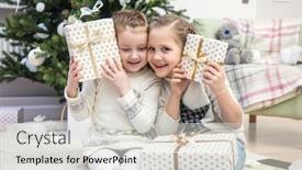  Presentation with christmas tree - Audience pleasing presentation theme consisting of two little girls open christmas present under the christmas tree backdrop and a light gray colored foreground