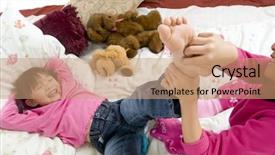  Presentation with bed - Audience pleasing presentation design consisting of two sisters playing on the bed tickling feet backdrop and a coral colored foreground