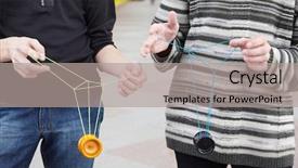  Presentation with teens - Presentation enhanced with two teens with yo-yo toys in their hands focus on clothes background and a light gray colored foreground