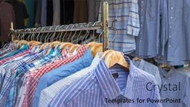  Presentation with clothes shop - Amazing PPT theme having used-shirts-in-the-secondhand backdrop and a teal colored foreground