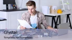  Presentation with computer hardware - Amazing PPT theme having using laptop in service center backdrop and a light blue colored foreground