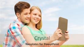  Presentation with computer love - Colorful theme enhanced with vacation holidays technology and love concept - smiling couple with tablet pc computer taking selfie over grass and blue sky background backdrop and a coral colored foreground