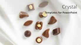  Presentation with tablecloth - Presentation theme consisting of various chocolate pralines on white tablecloth top view background and a light gray colored foreground
