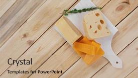  Presentation with cheddar - Presentation enhanced with various types of fresh raw aged delicatessen cheese on white plate over light wooden table cheddar edam swiss background and a coral colored foreground