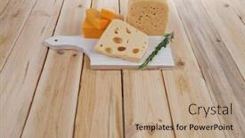  Presentation with cheddar - Theme consisting of various types of fresh raw aged delicatessen cheese on white plate over light wooden table cheddar edam swiss background and a coral colored foreground