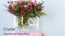  Presentation with flowers vase - Amazing PPT theme having vase mixed bouquet flowers on chair with blue background backdrop and a sky blue colored foreground