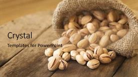  Presentation with natural - Theme consisting of roasted pistachios on natural wooden background and a coral colored foreground