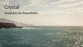  Presentation with close up view of the compass on old paper - PPT theme having view of rugged coastline close background and a light gray colored foreground