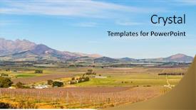  Presentation with cape town south africa - Audience pleasing theme consisting of vinyard - panoramic view across vineyards landscape backdrop and a light blue colored foreground