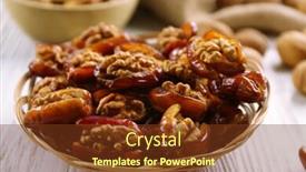  Presentation with date fruit - Presentation theme consisting of walnut and date fruit in plate on wooden table close-up background and a tawny brown colored foreground