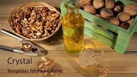  Presentation with walnut - Presentation theme enhanced with walnut oil and nuts on wooden table background and a coral colored foreground