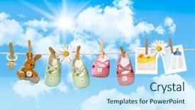  Presentation with baby bear - PPT layouts consisting of washing line - baby shoes pacifier and teddy background and a sky blue colored foreground