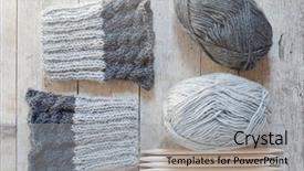  Presentation with needles - Presentation theme having soft skills - wool grey legwarmers knitting needles background and a light gray colored foreground