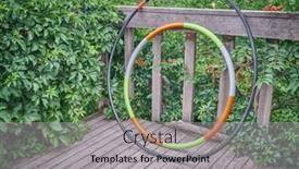  Presentation with workout - PPT theme having weighted-hula-hoop-and-one background and a light gray colored foreground