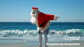  Presentation with santa claus holding scroll paper - PPT theme having while on a beautiful beach background and a seafoam green colored foreground