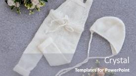  Presentation with knitted clothes - Presentation theme consisting of white-knitted-newborn-clothes-composition background and a gray colored foreground