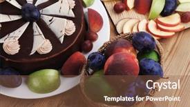  Presentation with table grape - PPT theme featuring whole big chocolate cream brownie cake topped with white chocolate and cream flowers with hot tea cup decorated with fruits apple plum and grape on plate on wooden table background and a tawny brown colored foreground