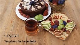  Presentation with table grape - Amazing PPT theme having whole big chocolate cream brownie cake topped with white chocolate and cream flowers with hot tea cup decorated with fruits apple plum and grape on plate on wooden table backdrop and a coral colored foreground