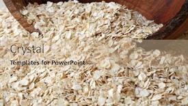  Presentation with spilling - Cool new presentation theme with whole grain rolled oats spilling out of a rustic wooden bowl close-up with shallow dof backdrop and a soft green colored foreground