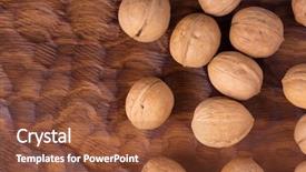  Presentation with dried fruits seeds nuts walnuts - Presentation featuring whole walnuts lying on carved background and a tawny brown colored foreground