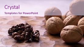  Presentation with dried fruits seeds nuts walnuts - PPT theme having whole walnuts lying on carved background and a sky blue colored foreground