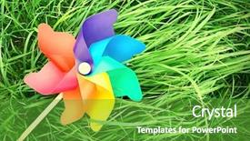  Presentation with pinwheel - Colorful PPT layouts enhanced with pinwheel lie on the grass backdrop and a tawny brown colored foreground