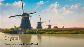  Presentation with windmills - Audience pleasing slide deck consisting of windmills-at-kinderdijk-in-holland backdrop and a yellow colored foreground