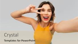  Presentation with mustard yellow - Presentation design consisting of winning gesture emotions and people concept - happy smiling young woman in mustard yellow top taking selfie and showing peace hand sign over grey background background and a yellow colored foreground
