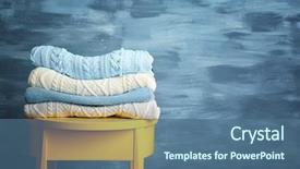  Presentation with clothing wooden clothes hanger object - PPT theme enhanced with winter - pile of clothes on wooden background and a ocean colored foreground