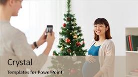  Presentation with christmas holidays - Audience pleasing theme consisting of winter holidays technology and people backdrop and a coral colored foreground