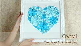  Presentation with heart flowers - Audience pleasing PPT theme consisting of woman hanging up picture backdrop and a soft green colored foreground