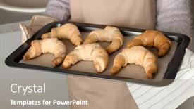  Presentation with baking - Slide set having woman holding baking sheet with freshly baked croissants closeup background and a coral colored foreground