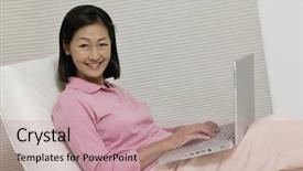  Presentation with laptop - Presentation theme with woman-in-chair-using-laptop background and a coral colored foreground