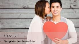  Presentation with heart - PPT layouts featuring woman kissing man holding heart against wooden plank background background and a soft green colored foreground