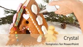  Presentation with gingerbread house - Audience pleasing presentation theme consisting of woman's hand decorating a colorful gingerbread house for christmas backdrop and a lemonade colored foreground