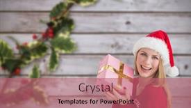  Presentation with holly - Audience pleasing theme consisting of woman smiling with present in hands against blurred holly on wood backdrop and a coral colored foreground