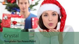  Presentation with kiss - Presentation theme consisting of woman-with-christmas-hat-blowing background and a ocean colored foreground