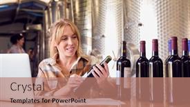  Presentation with winery - Presentation theme consisting of woman-with-laptop-checking-label background and a coral colored foreground