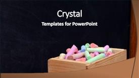  Presentation with coloured - Amazing PPT theme having wooden box of coloured chalk in front of blackboard backdrop and a black colored foreground