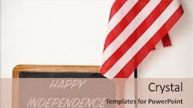  Presentation with independence day - Audience pleasing theme consisting of wooden-framed chalkboard with the text happy independence day written in it and a flag of the united states on a white background backdrop and a soft green colored foreground