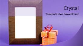  Presentation with gift ribbon - Colorful presentation design enhanced with wooden photo frame and orange gift box with red ribbon on purple background backdrop and a light blue colored foreground