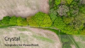  Presentation with woodland - Presentation having woodlands - aerial over half lush green background and a mint green colored foreground