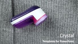  Presentation with knitting needles and wool - Presentation theme consisting of wool shaver on wool sweater background background and a gray colored foreground