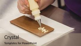  Presentation with plaque - Colorful theme enhanced with worker writing happy birthday with piping bag on chocolate plaque in kitchen backdrop and a coral colored foreground