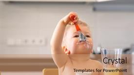  Presentation with toddler eating - PPT theme consisting of yoghurt with spoon dirty messy background and a coral colored foreground
