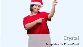  Presentation with hands down - Beautiful theme featuring young adult woman with down syndrome wearing christmas hat over isolated background smiling and looking at the camera pointing with two hands and fingers to the side backdrop and a white colored foreground