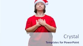  Presentation with hands down - Theme having young adult woman with down syndrome wearing christmas hat over isolated background smiling with hands on chest with closed eyes and grateful gesture on face health concept background and a sky blue colored foreground