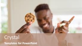  Presentation with cookies - PPT theme having young african american man eating chocolate chips cookies very happy pointing with hand and finger to the side background and a coral colored foreground
