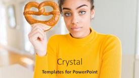  Presentation with salty - Audience pleasing PPT theme consisting of young african american woman eating german salty pastry pretzel with a confident expression on smart face thinking serious backdrop and a gold colored foreground