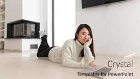  Presentation with laptop - Slides featuring young asian woman using laptop in front of fireplace on cold winter day at home background and a soft green colored foreground